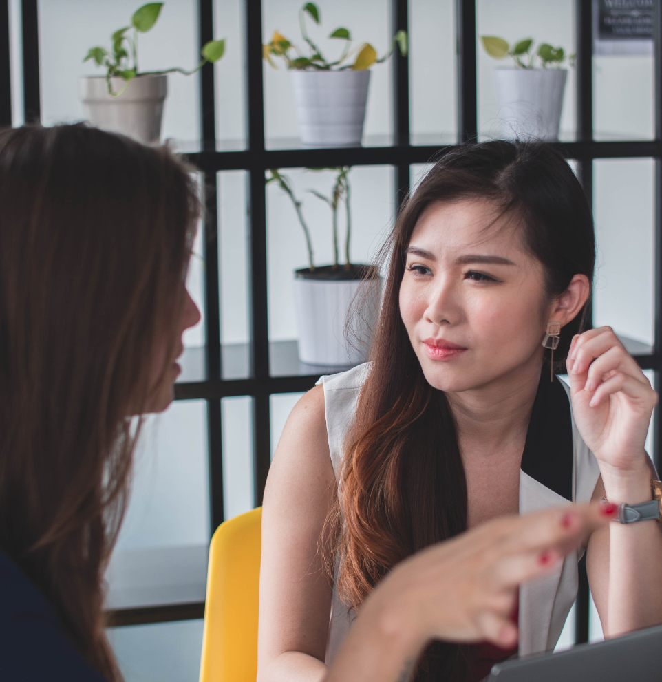 two business women talking