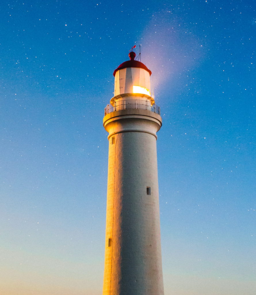 lighthouse with evening sky background signifying leadership of management consultants