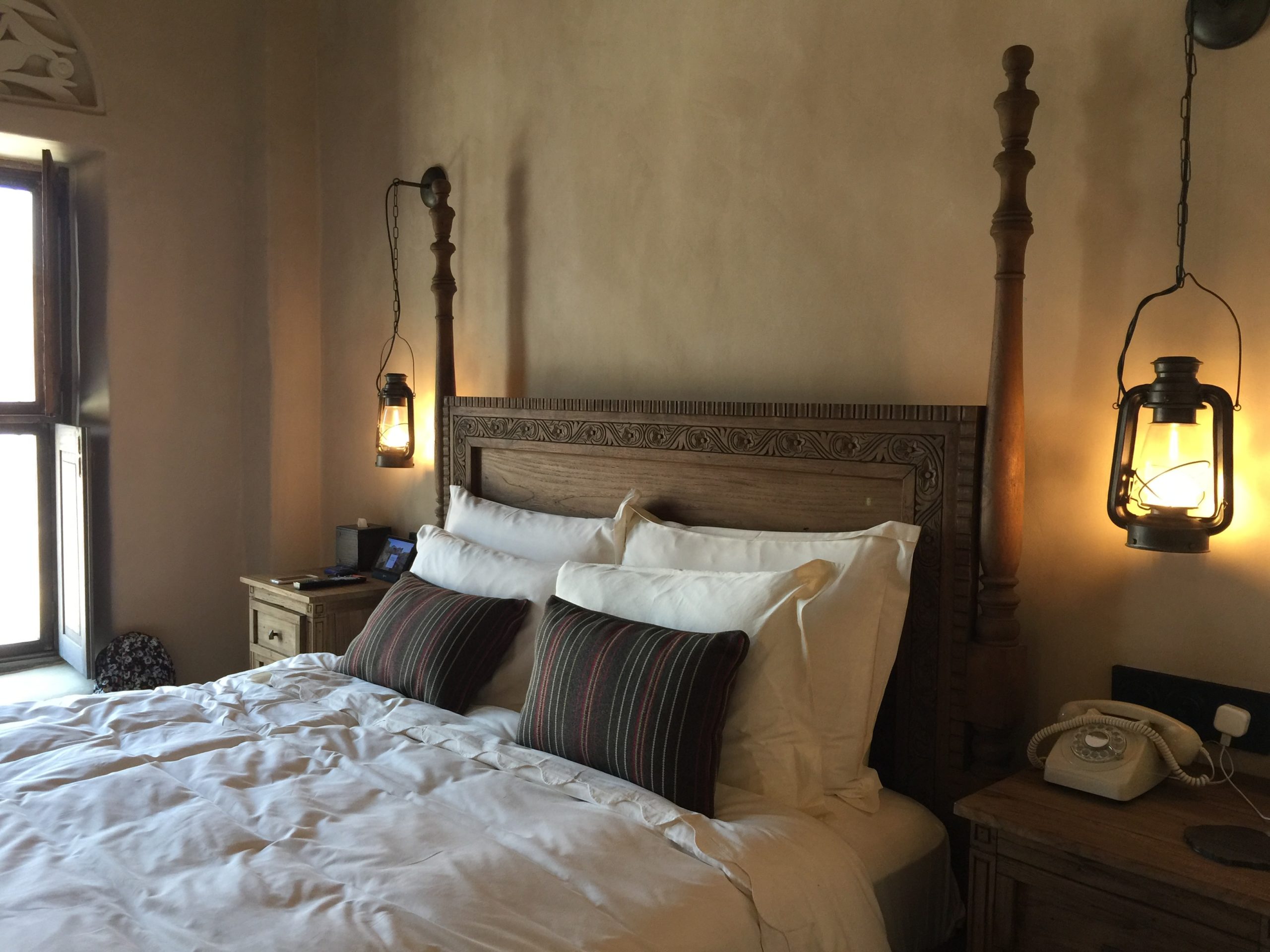 hotel bedroom with lantern bedside lamps