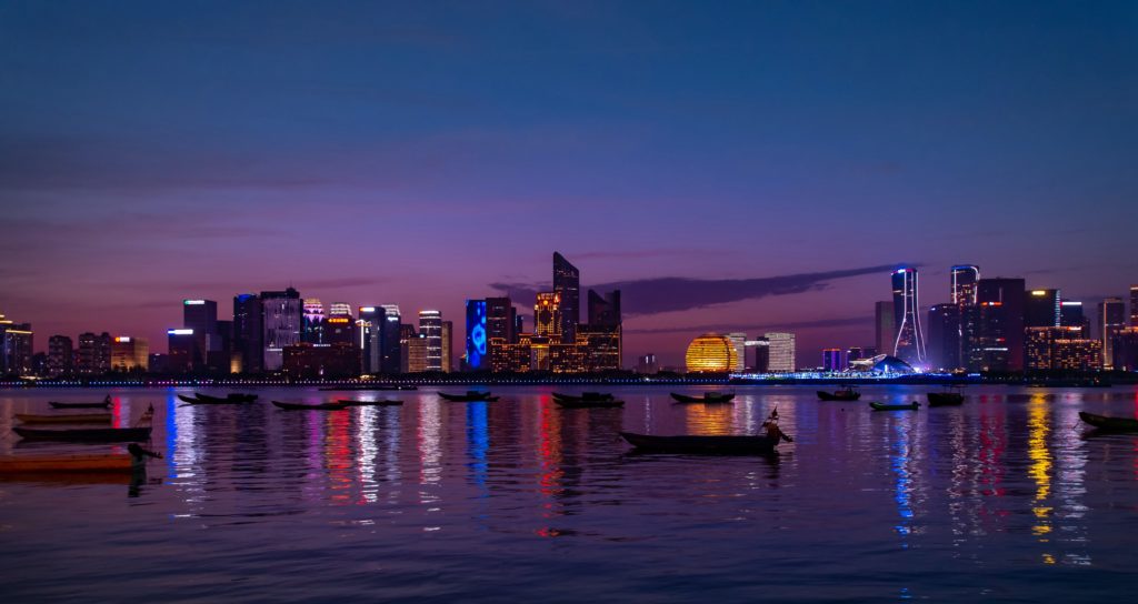 city skyline with a sunset background