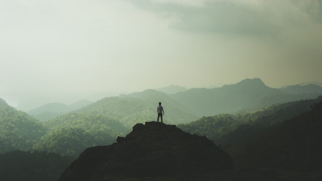 man standing on a mountain